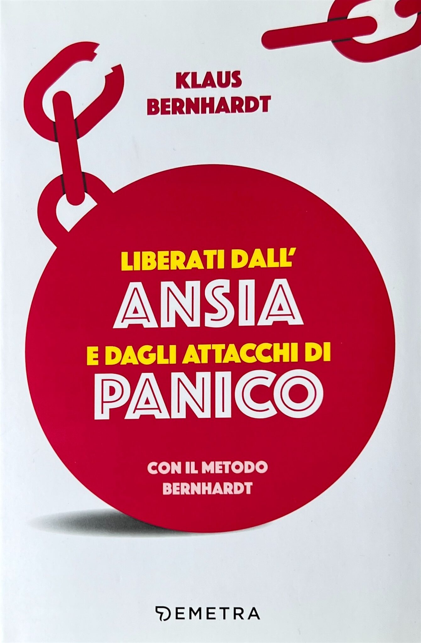 Cover eines italienischen Fachbuchs ueber die Bernhardt-Methode gegen Angststoerungen und Panikattacken. Darstellung schweren einer Eisenkugel an einer Kette, an der ein Kettenglied gerissen ist. Das Bild symbolisiert die Befreiung von Panikattacken.
