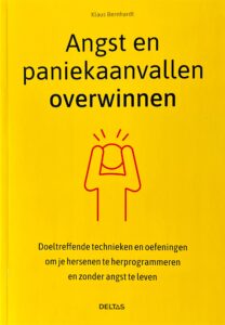 Niederlaendisches Fachbuch ueber die Bernhardt-Methode gegen Angst und Panik. Cover zeigt ein rotes Strichmaenchen, das sich den Kopf haelt auf gelbem Hintergrund.